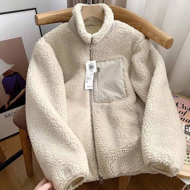 Cream fleece zip-up jacket with high collar and front chest pocket