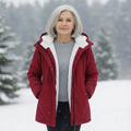Quilted winter coat in red with hood and sherpa lining, zip-front and side pockets.