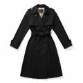 Black belted double-breasted trench coat with long sleeves and notched lapels.