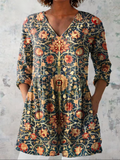Women’s drapey V-neck blouse, long sleeves, multicolor ornate print