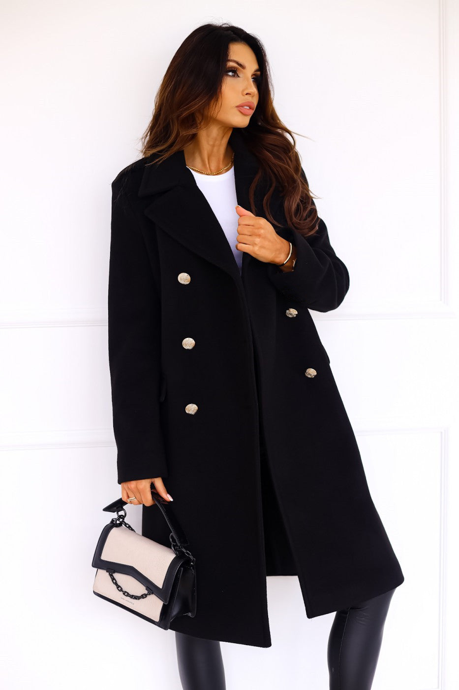 Black long double-breasted overcoat with gold button placket and side slit hem