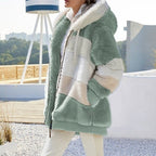 Mint green plush hooded vest with cream paneling, front zipper, and cozy sherpa lining
