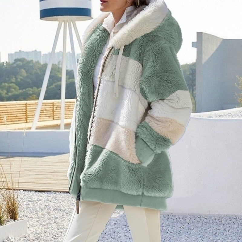 Mint green plush hooded vest with cream paneling, front zipper, and cozy sherpa lining