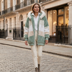 Women’s oversized plush hooded vest with front zipper, mint green and cream panels, elastic cuffs