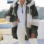 Dark green plush hooded vest with cream and textured fleece blocks, full zipper, warm lining