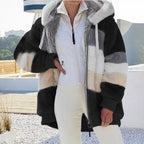 Black plush hooded vest with cream and gray patchwork blocks, front zipper, soft fleece feel