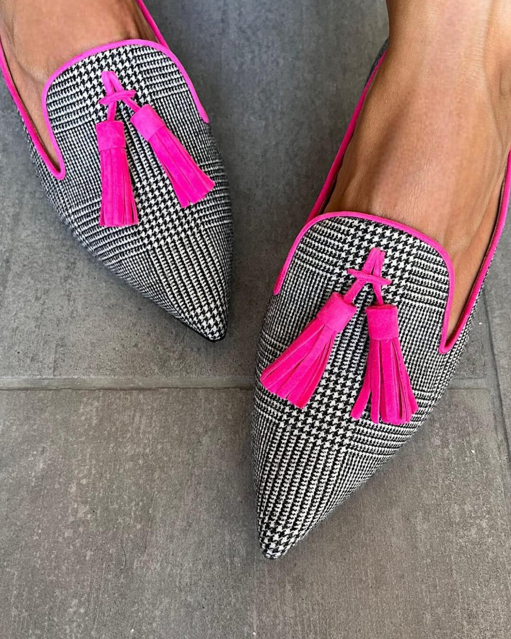 Printed pointed loafers with neon pink tassel detail and black, white check fabric