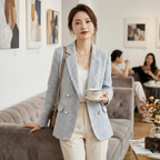 Women's light blue checked blazer with notched lapels and front button details