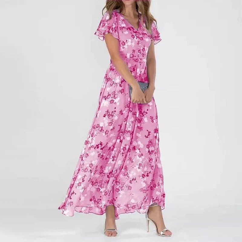 Pink floral midi dress with V-neck and flutter sleeves, cinched waist, full skirt