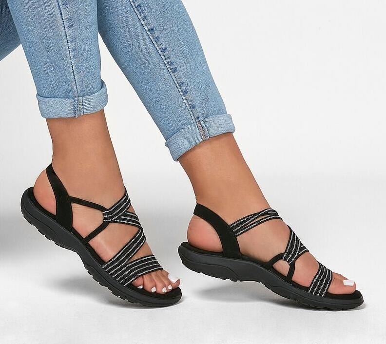 Black slip-on sandals with crisscross striped straps and open toe cushioned sole
