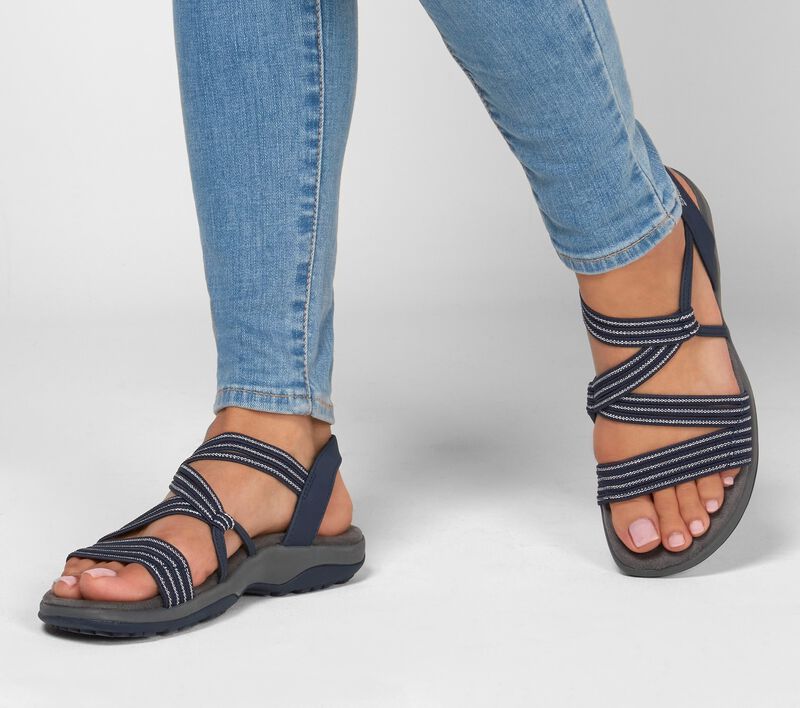 Navy slip-on sandals with crisscross striped straps, open toe, and cushioned sole