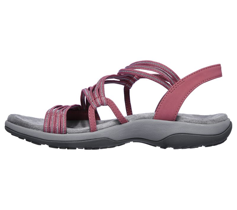 Pink slip-on sandals with crisscross two-strap design and grey rubber sole