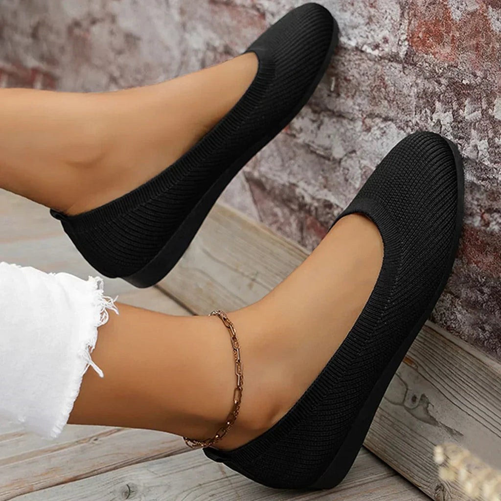 Black stretch knit ballerina flats with low profile and rounded toe