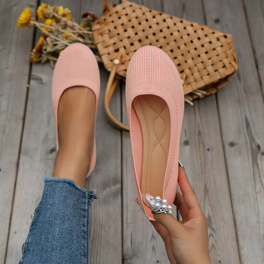 Pink stretch knit slip-on ballerina flats with rounded toe