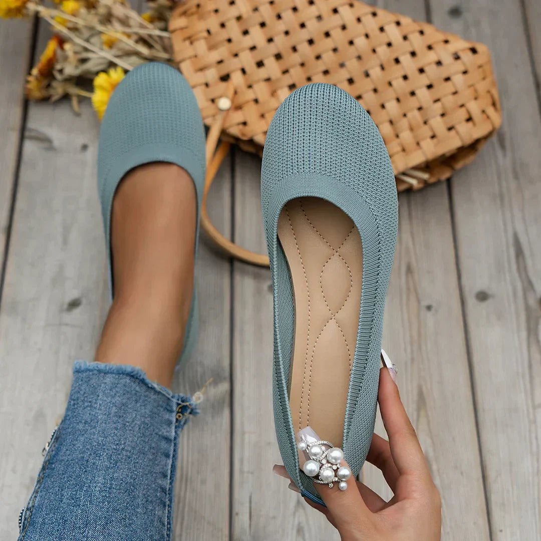 Light blue stretch knit slip-on ballerina flats with rounded toe