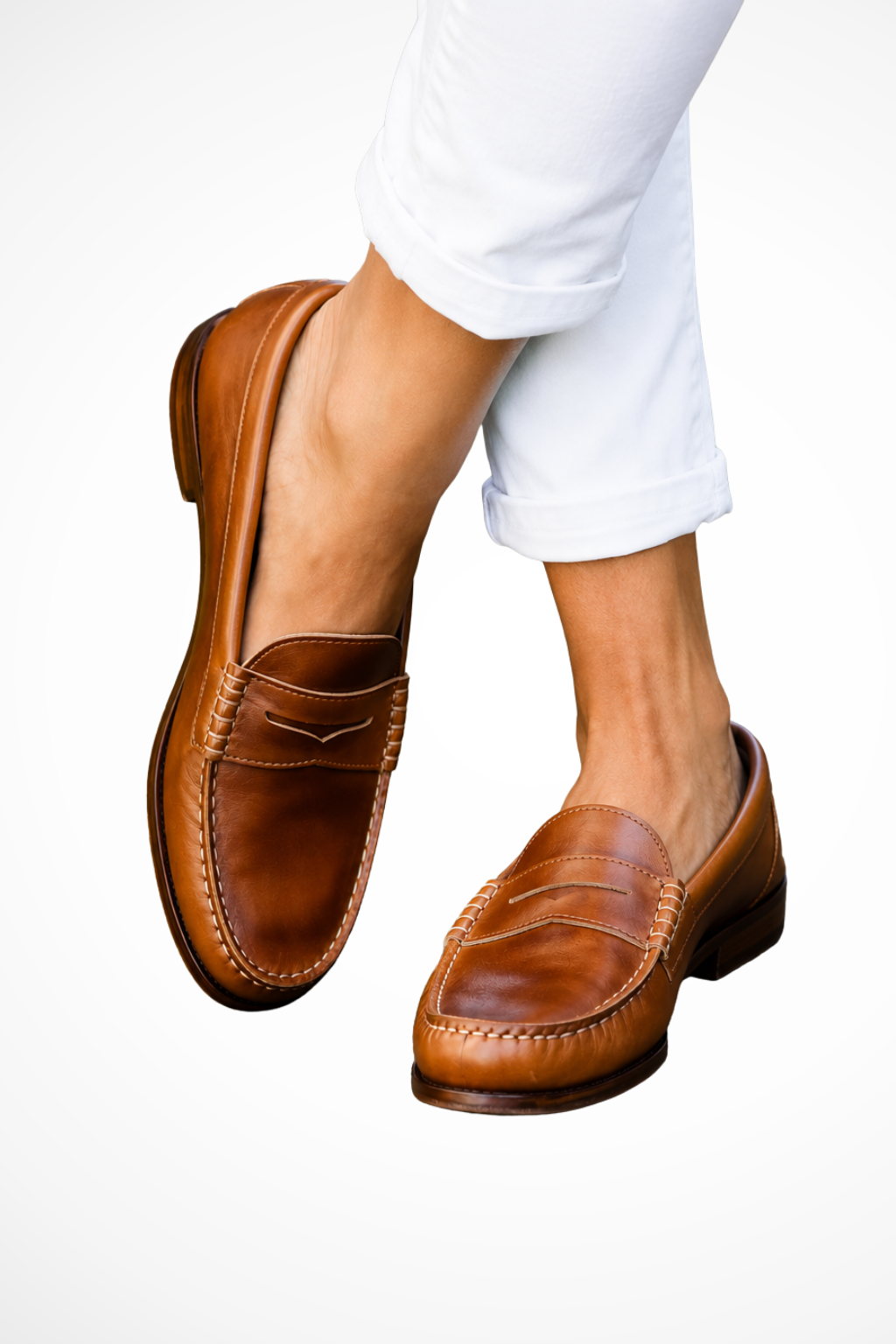 Leather penny strap loafers in brown, slip-on style with stitched apron and low heel