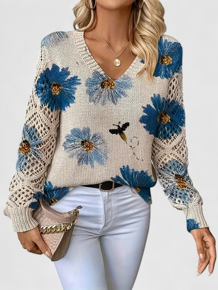 Floral knit cardigan with blue and yellow flower print, V-neck and crochet-style cuffs