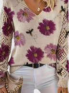 Floral knit cardigan close-up in cream with purple flower print, V-neck and textured cuffs