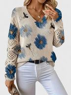 Floral knit cardigan in cream with blue flower print, V-neck and ribbed hem cuffs
