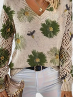 Floral knit cardigan in cream with green flower print, V-neck and crochet-style sleeve accents