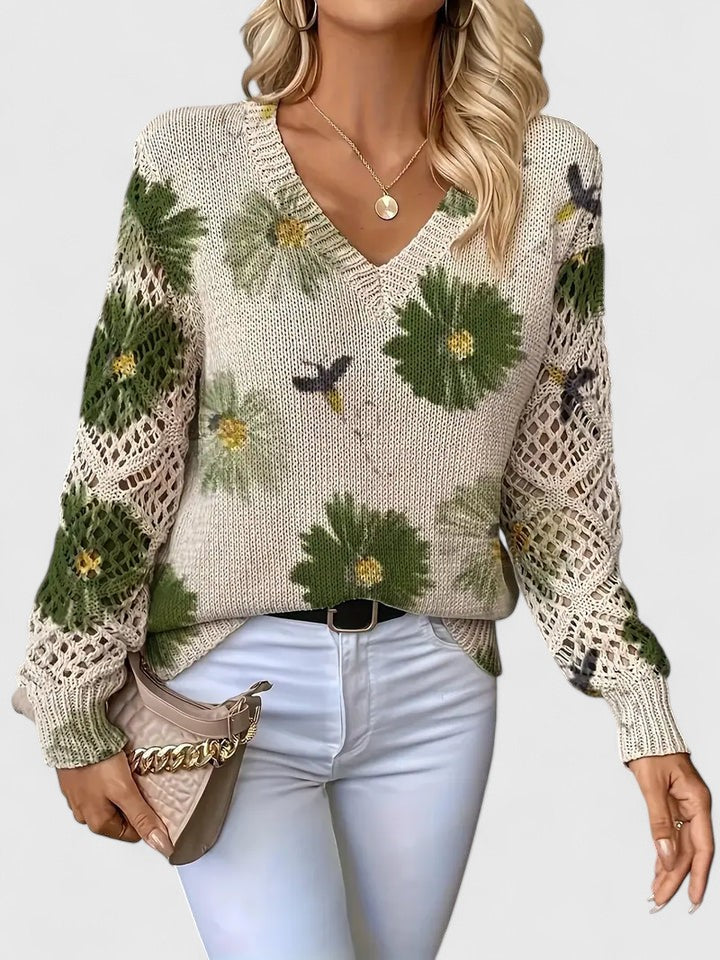 Floral knit cardigan with cream base and green flower print, V-neck and crochet-style sleeve details