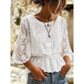 White lace-embroidered peplum blouse with sheer lace sleeves and V-neck