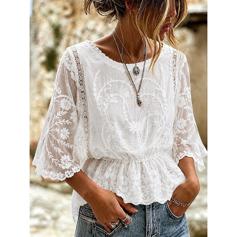 White lace-embroidered peplum blouse with sheer lace sleeves and V-neck