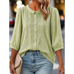 Light green embroidered blouse with peter pan collar and button-front, puff sleeves