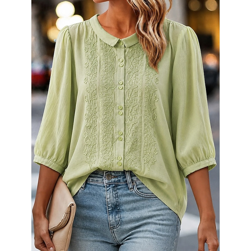 Light green embroidered blouse with peter pan collar and button-front, puff sleeves