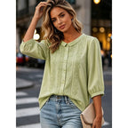Light green embroidered blouse with peter pan collar and button-front, loose puff sleeves