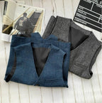 Two men's sleeveless vests: blue denim-style and gray with button front and flap pockets