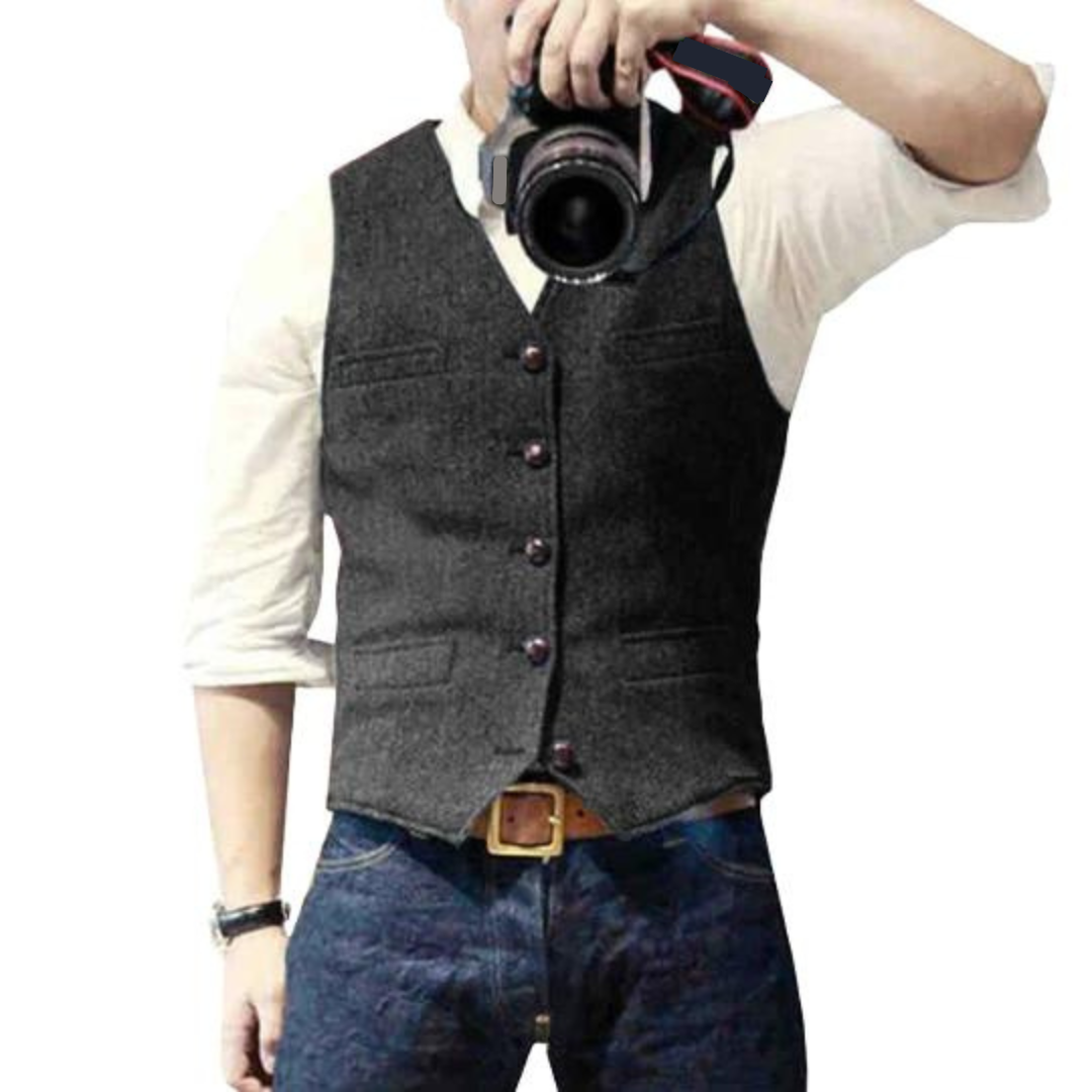Men's dark gray sleeveless vest with V-neck and button front, flap pockets at chest and waist