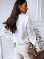 Danore white high-cuff blouse, side view, button placket and snap-style cuffs