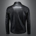 Black leather motorcycle-style jacket back view with center seams and two side pockets.