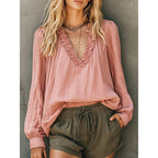 Pink ruffled V-neck blouse with long sleeves and gathered neckline trim