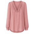 Pink womens ruffled V-neck blouse with long puff sleeves and relaxed fit