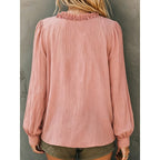 Pink ruffled V-neck blouse, back view with gathered collar and balloon cuffs