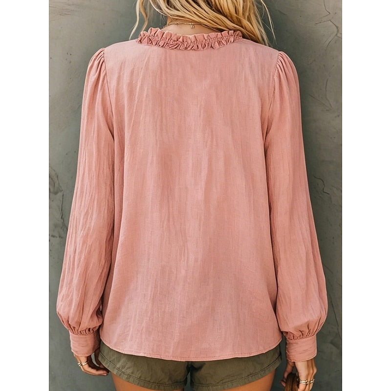 Pink ruffled V-neck blouse, back view with gathered collar and balloon cuffs