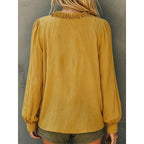 Yellow ruffled V-neck blouse, back view with elastic cuffs and yoke gathers