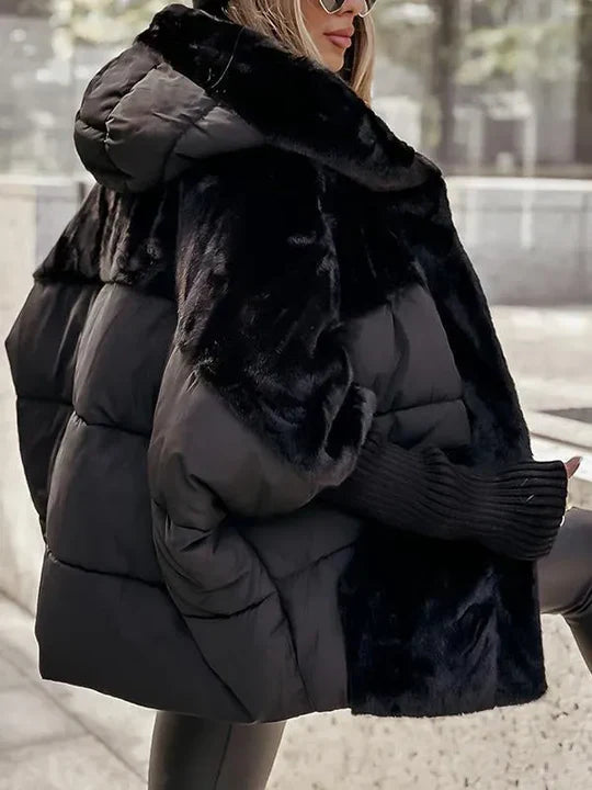 Women’s warm winter jacket in black with quilted puffer body and faux-fur hood lining