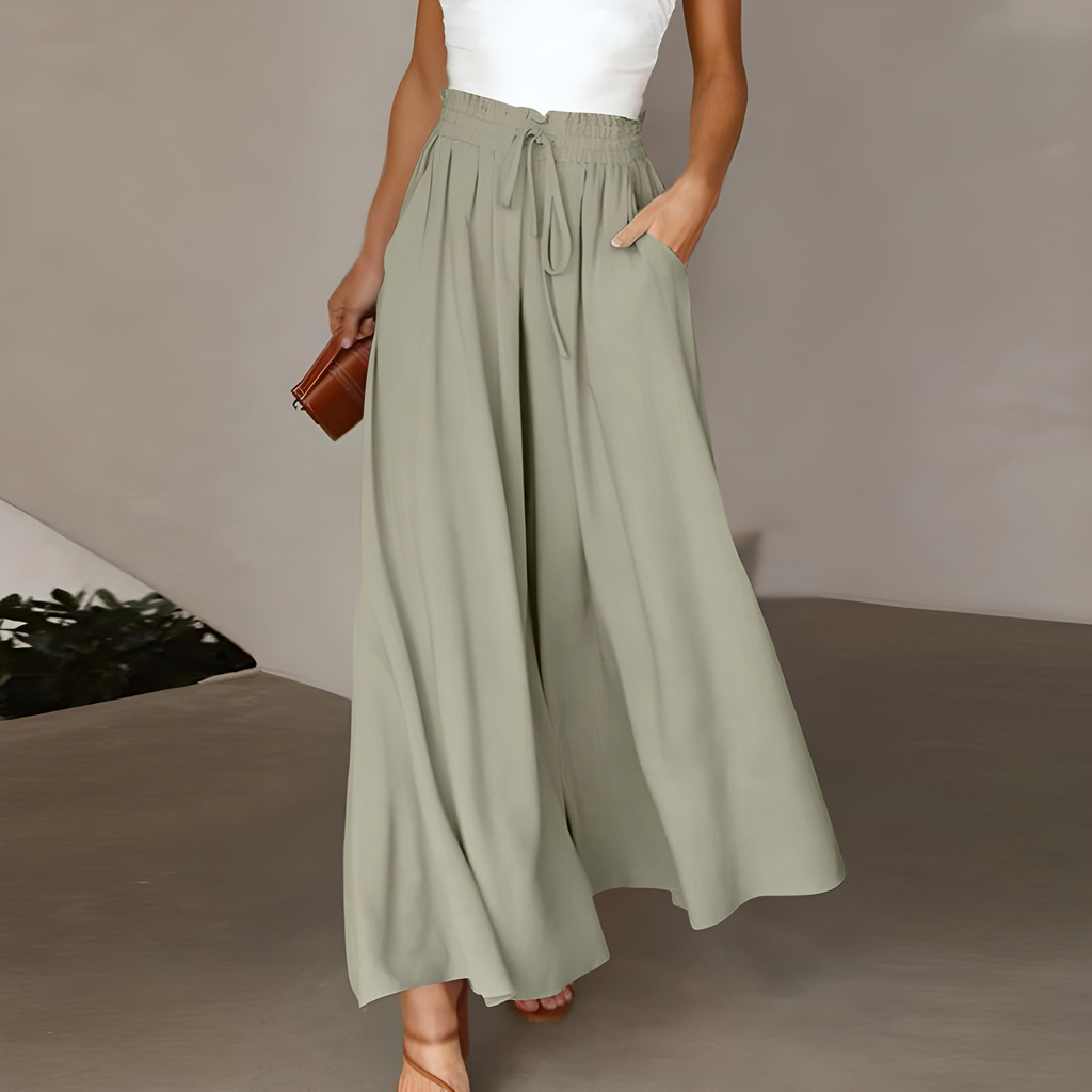 Sage green high-waisted wide-leg trousers with elastic drawstring waist and pleated drape