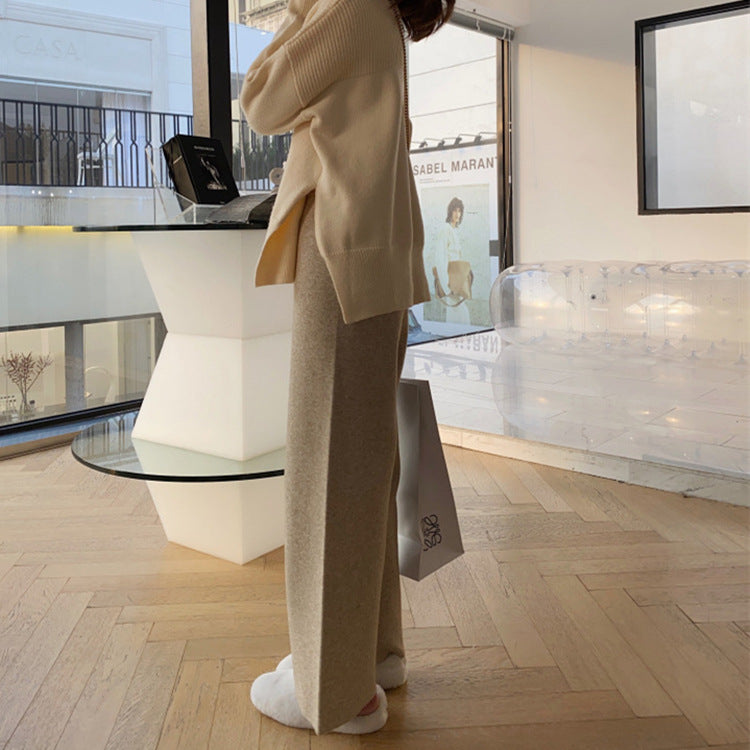 Camel brown wide-leg palazzo trousers with relaxed fit and wide straight legs.