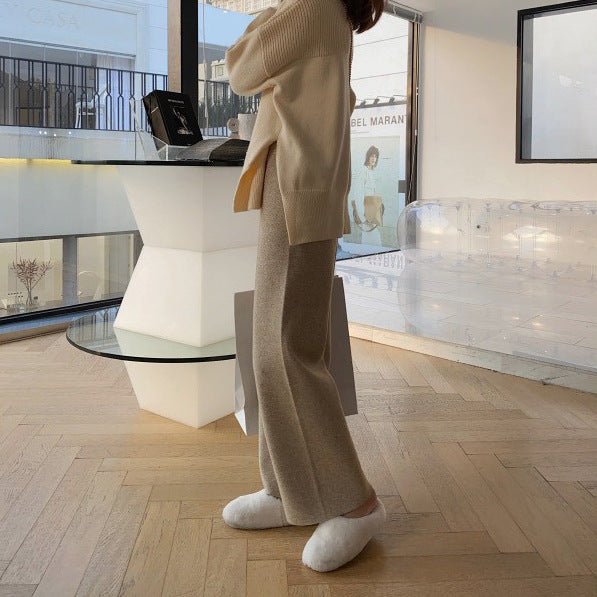 Taupe/brown wide-leg palazzo trousers with relaxed fit and wide straight legs.