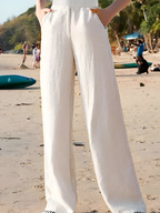 White wide-leg linen trousers with front pleat, wide straight legs