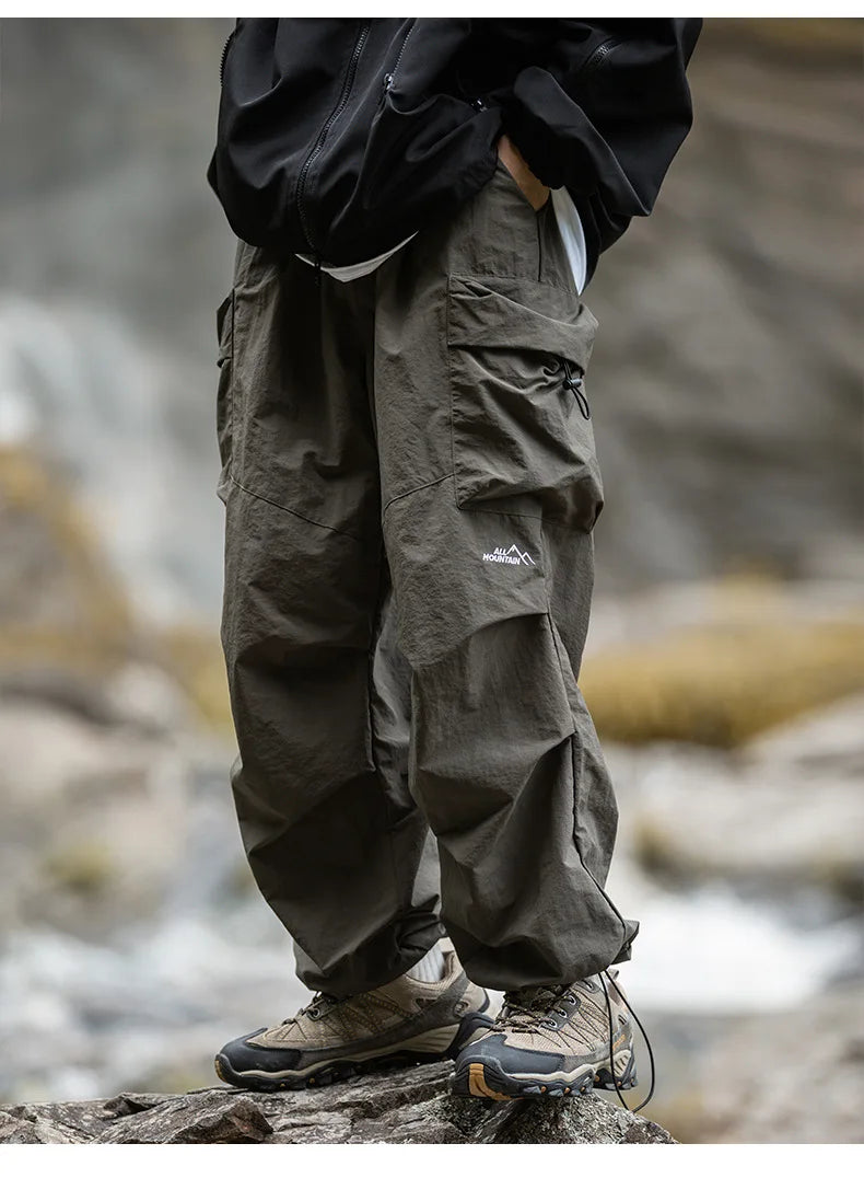 Army green relaxed cargo trousers with multiple flap pockets and cuffed hems