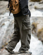 Army green relaxed cargo trousers with flap cargo pockets and cinched ankle cuffs
