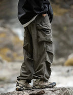 Dark army green relaxed cargo trousers with cargo flap pockets and ankle cuff ties