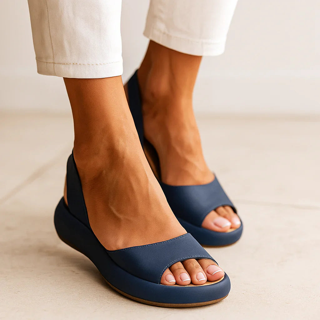 Women's slingback sandals, navy open-toe slip-on with cushioned footbed.