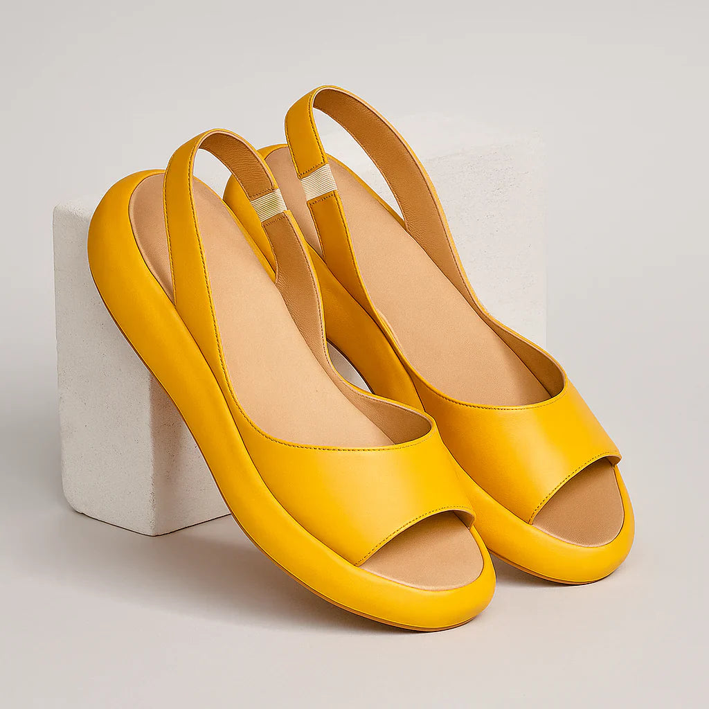 Women's slingback sandals, yellow open-toe slip-on, pair shown from above.