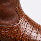 Brown leather ankle boot with stitched crocodile-print side panel